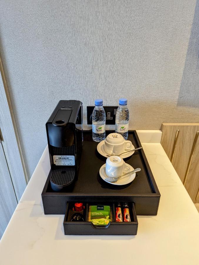 Citadines Abha Aparthotel Exteriör bild A Nespresso coffee machine in a hotel room